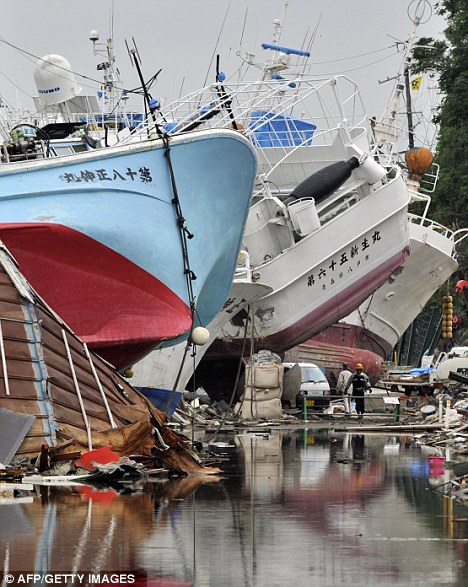 Pile up: Boats are still stacked against one another in Kesennuma, Miyagi prefecture, 100 days after the earthquake struck Japan